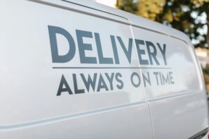 Close-up of delivery van with slogan 